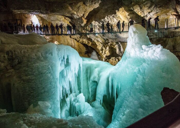 Suspension bridge over gigantic ice formations in a cave