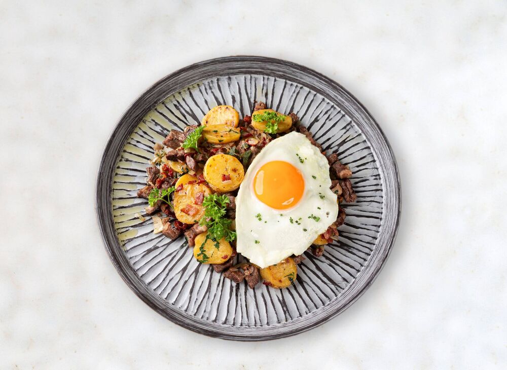 Plate with Tyrolean Gröstl and fried egg