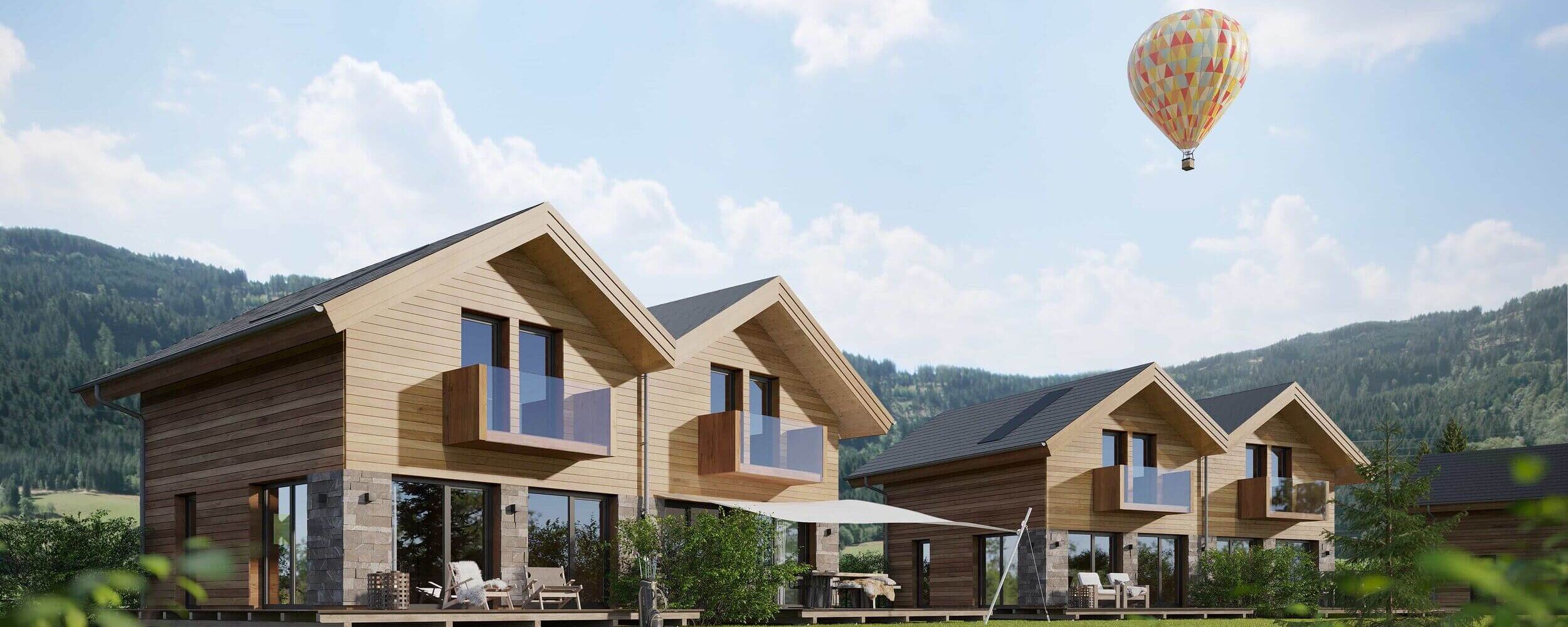 Moderne vakantiehuizen van Sonnenchalets Murau met terrassen, een tuin en uitzicht op de omliggende bergen.