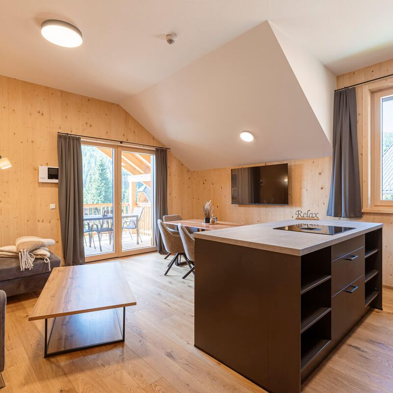 Dining and living area with lots of wood