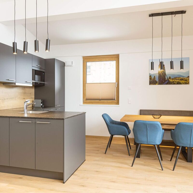 High quality, modern kitchenette and dining table in a holiday apartment