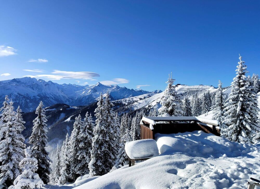 View of the snow covered Schmittenhöhe and the Kitzsteinhorn glacier ski area