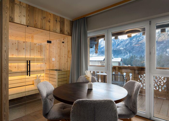 Living area with direct view into the sauna and of the Kaprun mountains