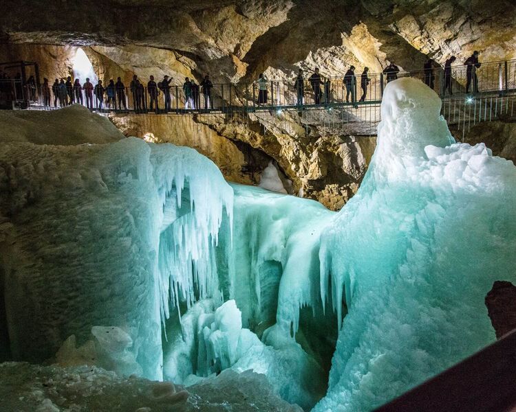 Suspension bridge over gigantic ice formations in a cave