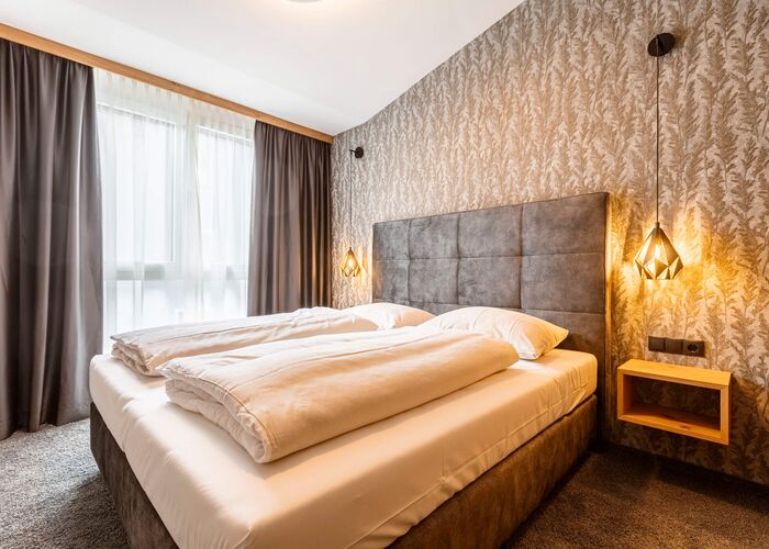 Slaapkamer   Zillertal Suites Fügen by ALPS RESORTS