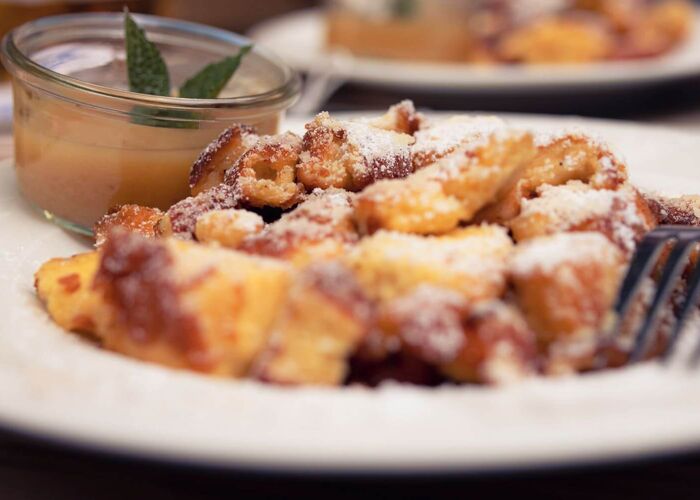 Kaiserschmarrn with apple sauce and powdered sugar