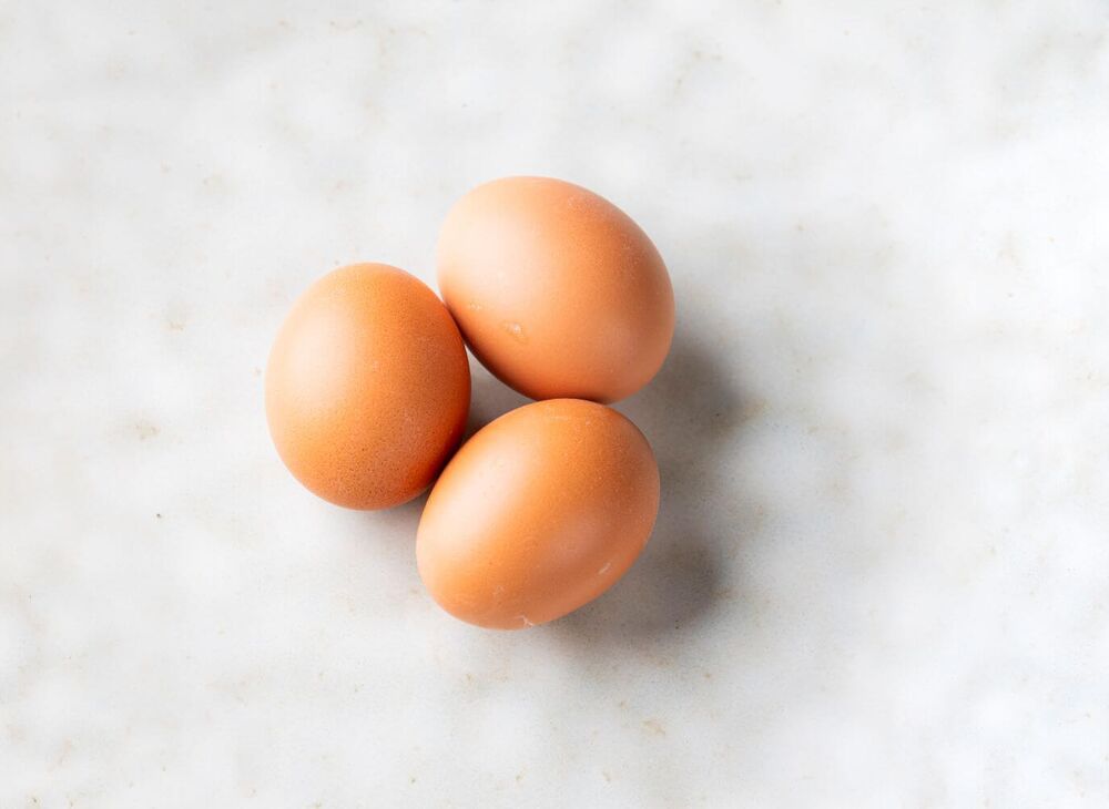 Three eggs on a kitchen plate