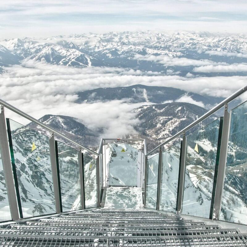 Viewing platform at the Dachstein Glacier in winter overlooking the snow-covered mountains.