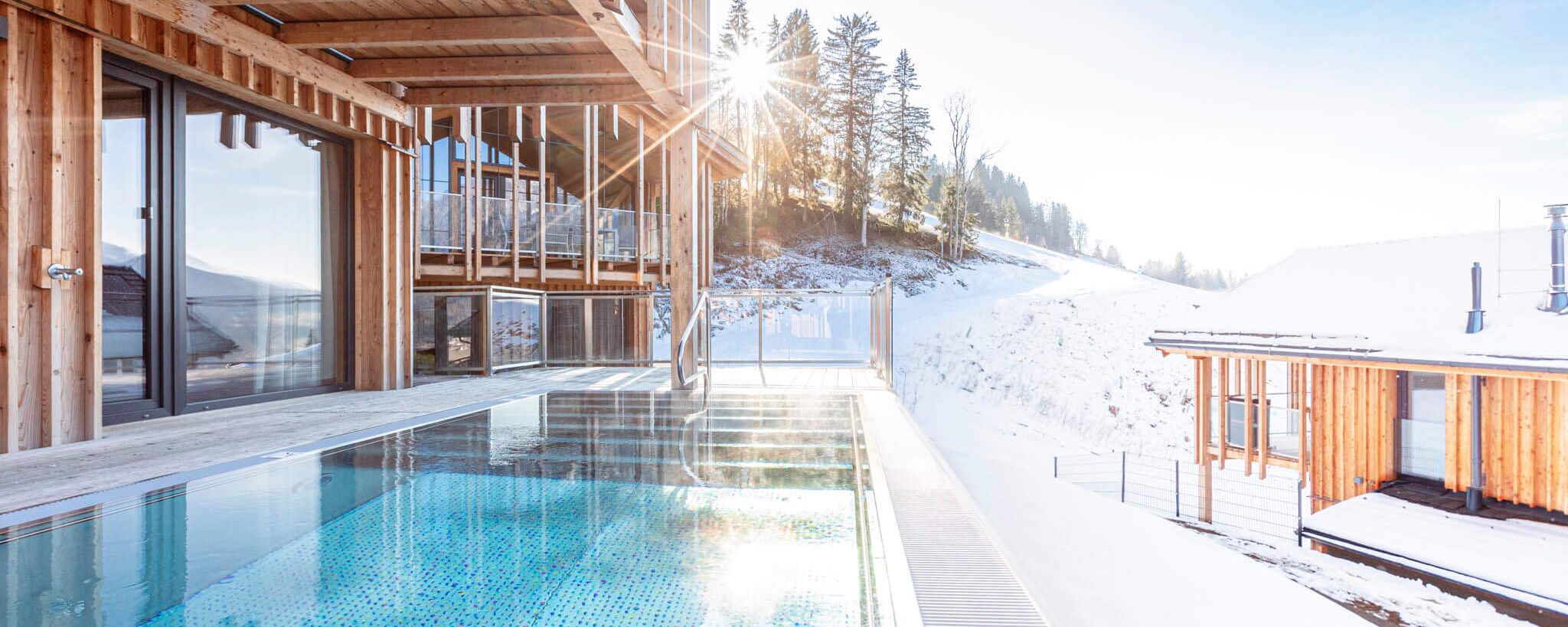 Sun shines on crystal clear water in the private pool on the terrace of the holiday home