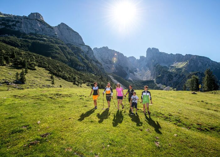 Family hiking on the Gossaukamm ridge with beautiful views of the mountains