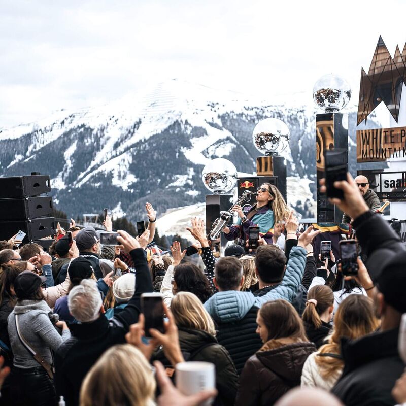 Celebrating people at the White Pearl Mountain Days in Saalbach