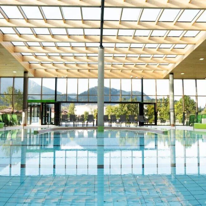 Indoor pool at Alpentherme Ehrenberg with panoramic mountain views