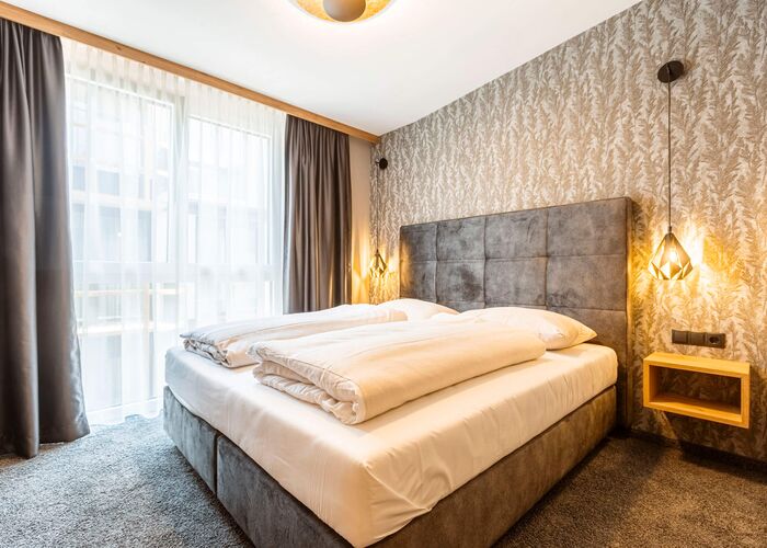 Slaapkamer   Zillertal Suites Fügen by ALPS RESORTS