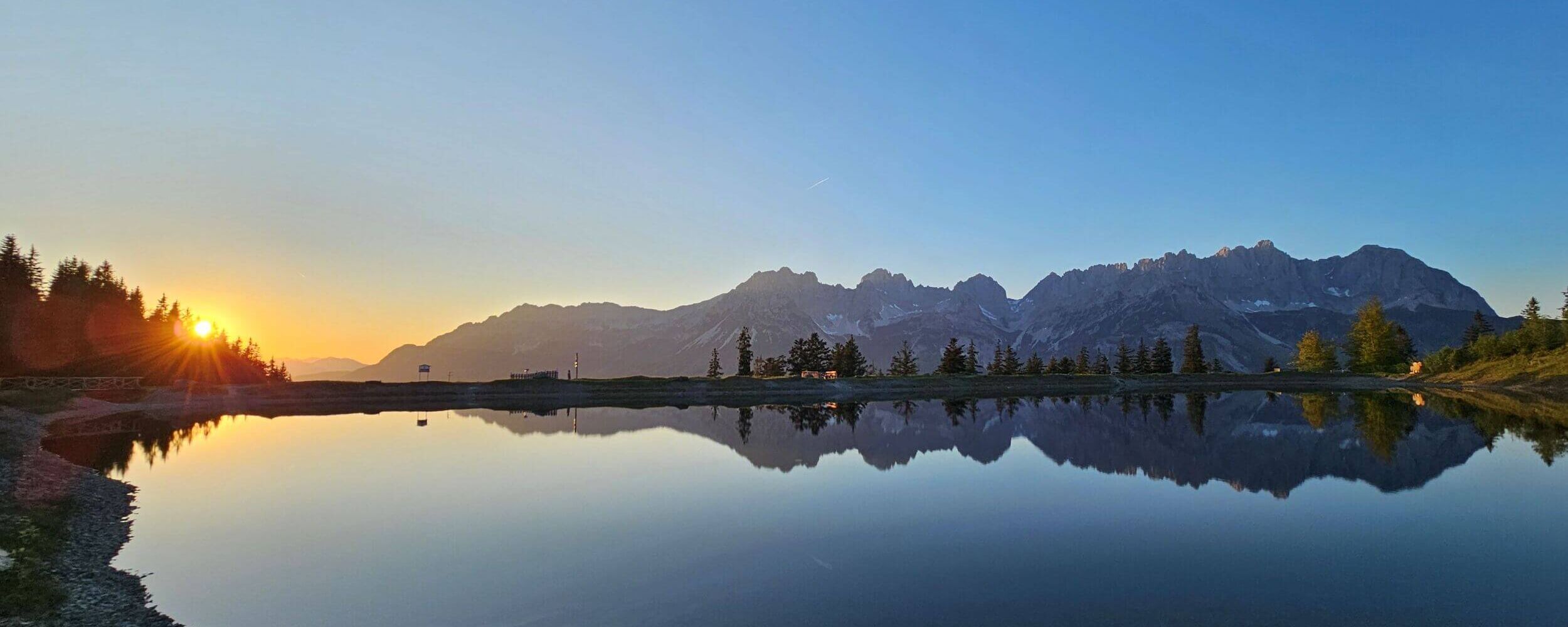 Astbergsee lake at sunset with a view of the Wilder Kaiser