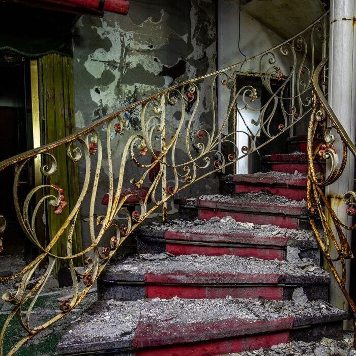 Collapsed spiral staircase with wrought iron railing in the former Berwanger Hof