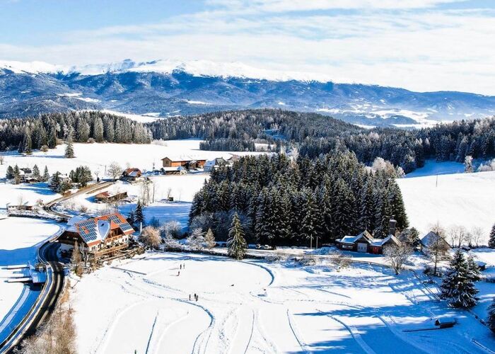 Aerial view of the frozen ice skating area in Zirbitzkogel Grebenzen Nature Park