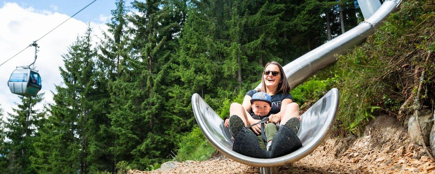 Tubing slides wind their way through the woods along the Sliding Trail in Neukirchen.