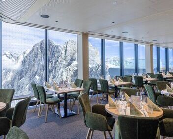 Interior of the glacier restaurant with views of the surrounding mountains.