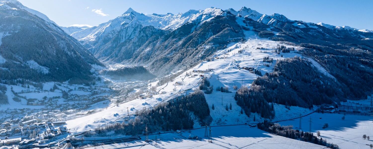 Aerial view of the snow covered Maiskogel ski area above Kaprun in winter