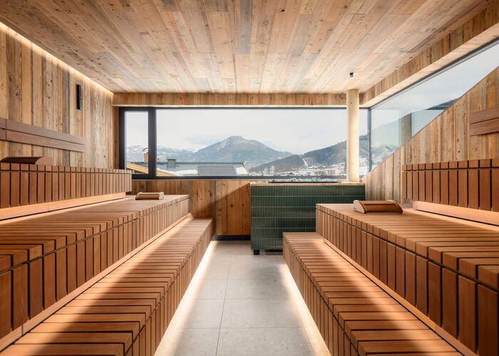 Large sauna with indirect lighting and beautiful view