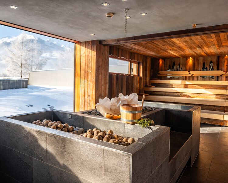 Sauna with mountain crystals and panoramic window overlooking the snowy landscape