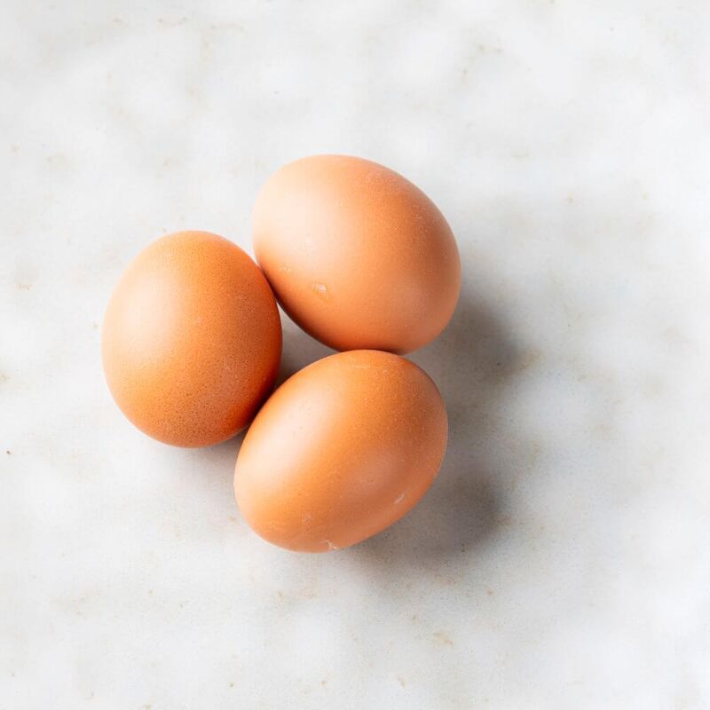 Three eggs on a kitchen plate