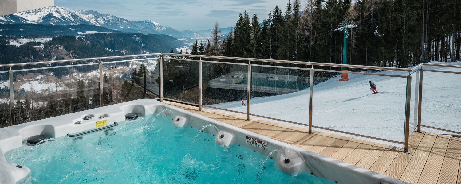 Pool at the chalet in front of ski slopes   Reiteralm in Schladming