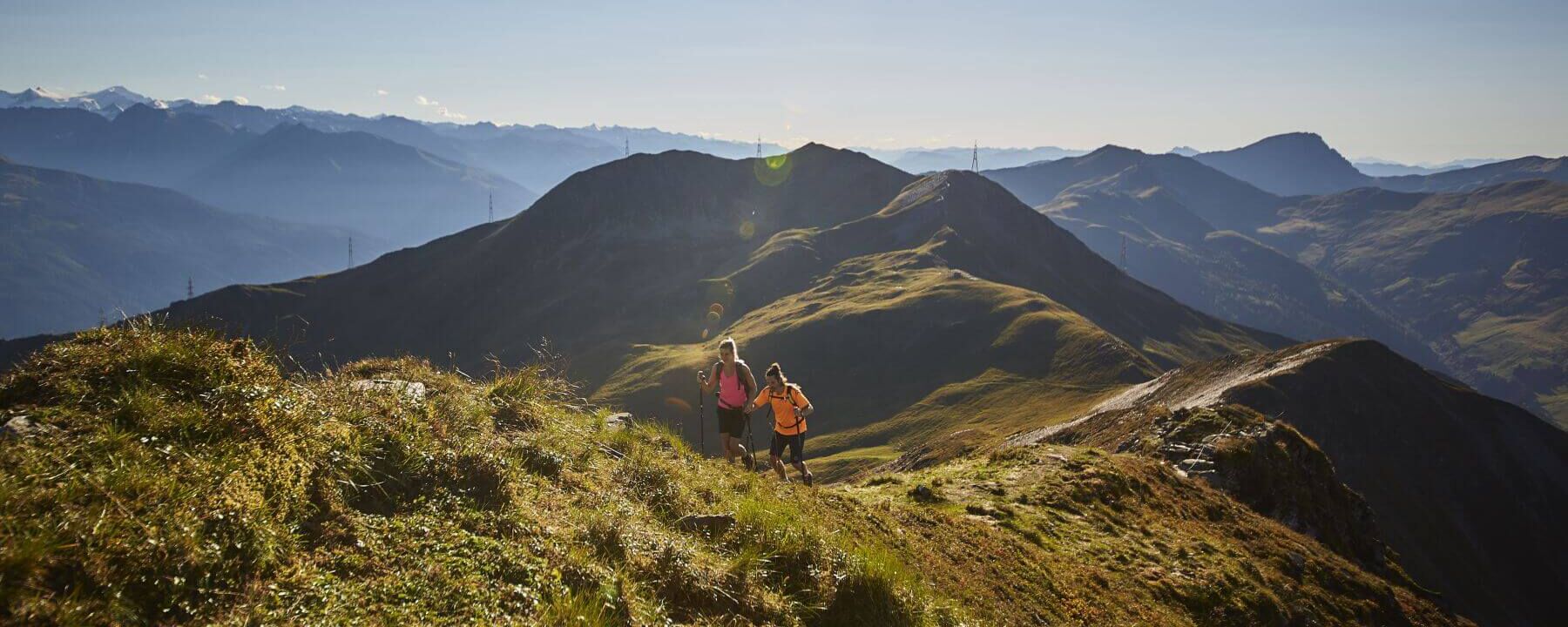 Hikers in Saalbach Hinterglemm with a view of the mountains