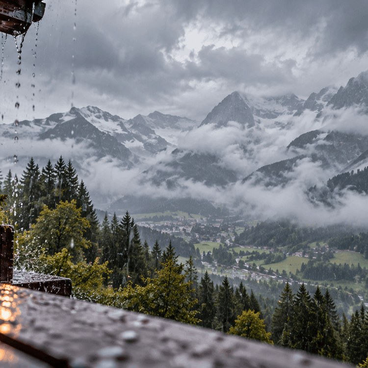 Rainy mountain landscape in Schladming Dachstein with thick clouds and mist