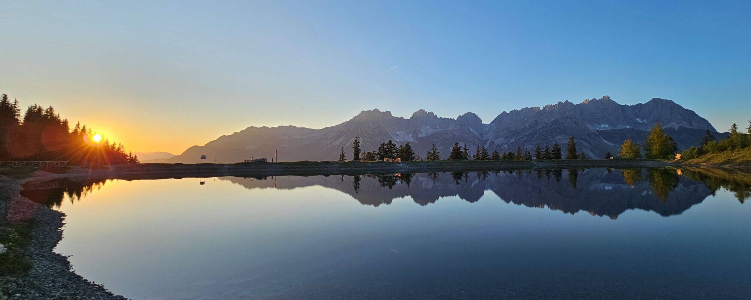 Astbergsee lake at sunset with a view of the Wilder Kaiser