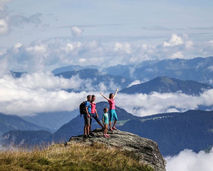 Family at a viewpoint while hiking in the Zillertal.