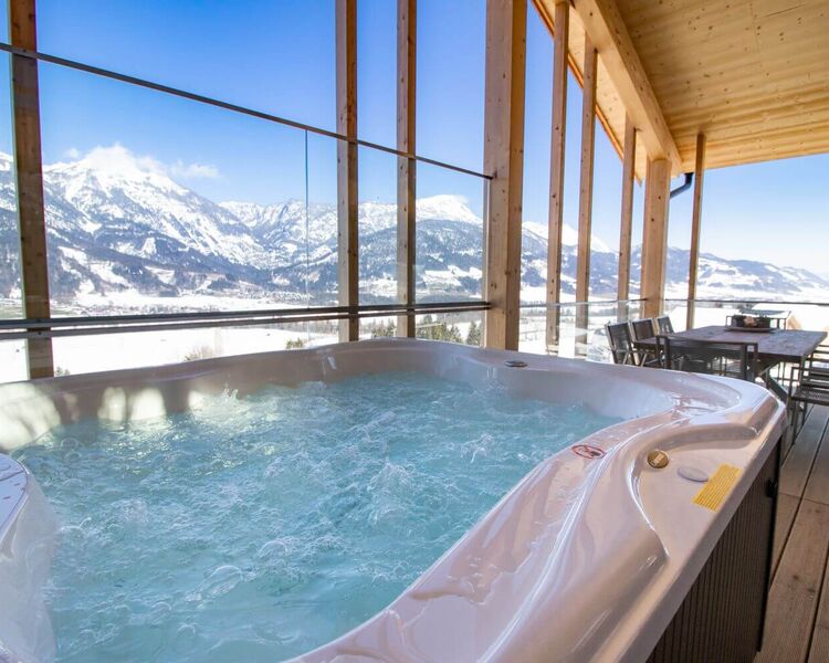 Bubbling whirlpool on the terrace of a vacation home in winter