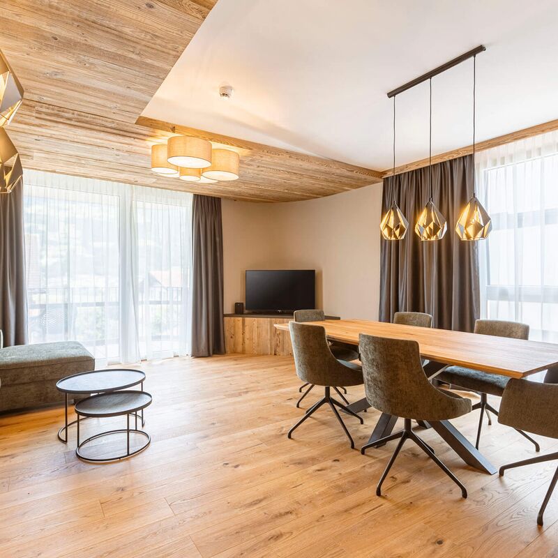 Elegant holiday apartment with a large dining table in the living area