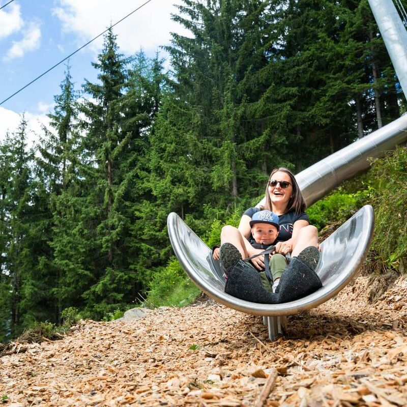 Tubing slides wind their way through the woods along the Sliding Trail in Neukirchen.